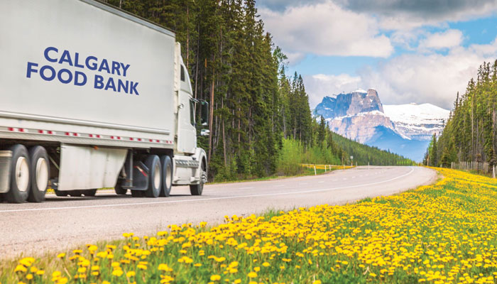 Semi Truck driving through mountains.