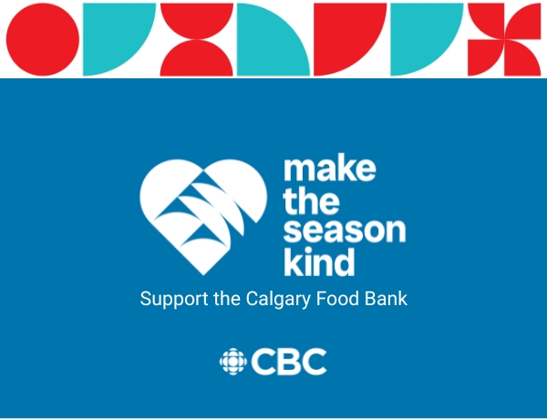 Indigenous man standing in the Calgary cityscape and leaning against a railing